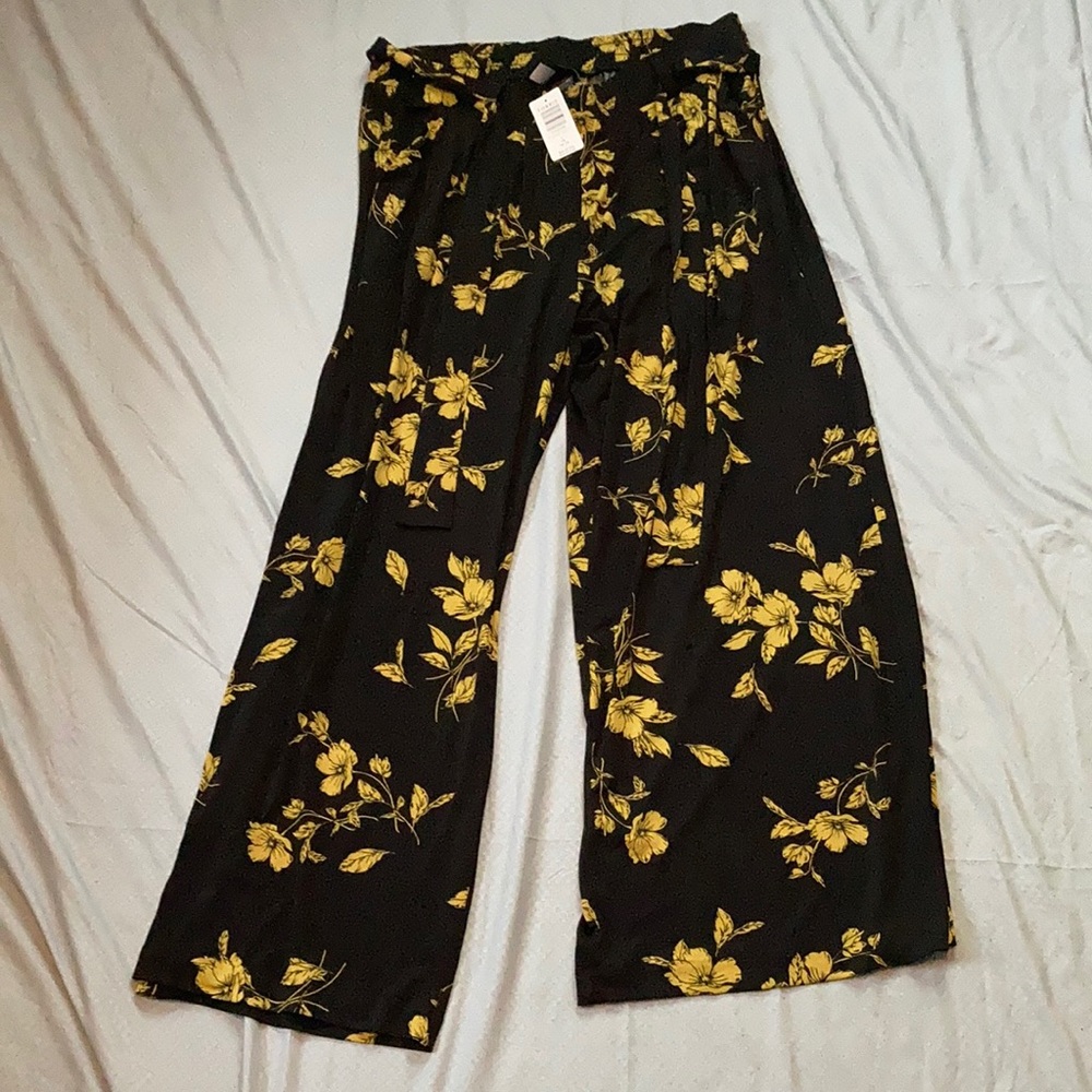 Torrid: Black and yellow floral pants.